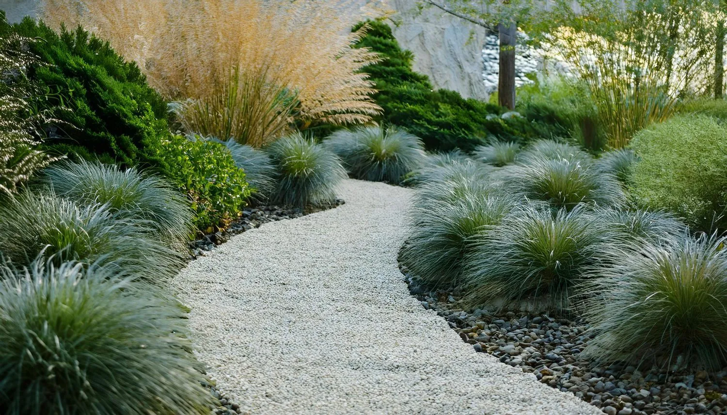 A landscaped garden path through a lush green lawn